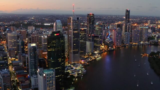 Cityscape Of Brisbane Central Business District With Brisbane River At Night In Brisbane, Queensland, Australia. - aerial drone shot