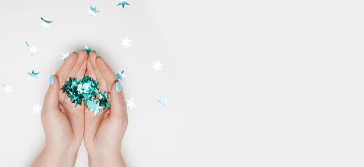 Pinecones and pine's branches on wooden background.