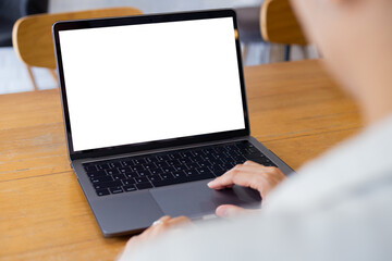 computer blank screen mockup.hand woman work using laptop with white background for advertising,contact business search information on desk at coffee shop.marketing and creative design