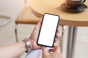 cell phone blank white screen mockup.woman hand holding texting using mobile on desk at office.background empty space for advertise.work people contact marketing business,technology