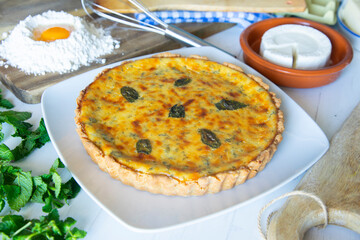 Flaó traditional dessert from Ibiza. The cheesecake is a unique combination of flavors — anise and mint.  The filling is made from fresh cheese (or ricotta and mascarpone), eggs and chopped mint.