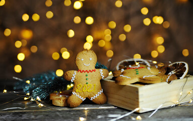 Christmas cookies with cinnamon on wooden background.