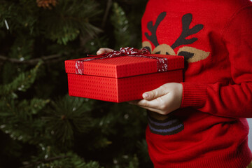 Child holding christmas gift
