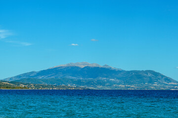 Blue background with mountains and sea