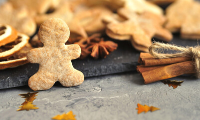 Christmas cookies with cinnamon on wooden background.