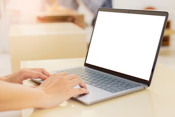 computer blank screen mockup.hand woman work using laptop with white background for advertising,contact business search information on desk at coffee shop.marketing and creative design