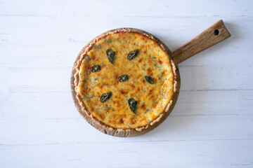 Flaó traditional dessert from Ibiza. The cheesecake is a unique combination of flavors — anise and mint.  The filling is made from fresh cheese (or ricotta and mascarpone), eggs and chopped mint.