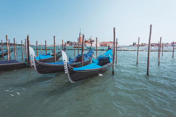 Fototapeta na wymiar Venice, gondolas docked near the shore, Italy