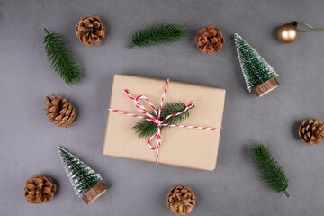 Christmas holiday composition with gift box decoration, new year and xmas or anniversary with presents on cement floor background in season, top view or flat lay, copy space.
