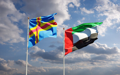 Beautiful national state flags of UAE United Arab Emirates and Aland Islands together at the sky...