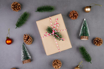 Christmas holiday composition with gift box decoration, new year and xmas or anniversary with presents on cement floor background in season, top view or flat lay, copy space.