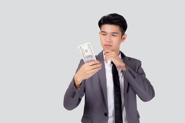 Young asian business man in suit holding dollar money isolated on white background, businessman think idea about finance for success, male holding cash with banknote and question, one person.