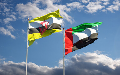 Beautiful national state flags of UAE United Arab Emirates and Brunei together at the sky background. 3D artwork concept.