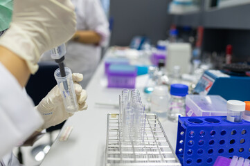 Fototapeta premium Chemists mixed up chemical to find antiretroviral drugs at the lab,Experiment to detect virus was found in the blood,Developers of potential medicines and vaccines against COVID-19