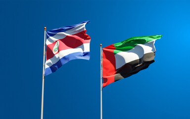 Beautiful national state flags of UAE United Arab Emirates and Costa Rica together at the sky background. 3D artwork concept.