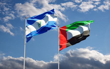 Beautiful national state flags of UAE United Arab Emirates and El Salvador together at the sky background. 3D artwork concept.