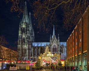 Cologne Cathedral Christmas Market in night, Germany. This is the most popular and best-known of all the city markets in front of the famous Cologne Cathedral. - 391262393