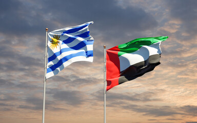 Beautiful national state flags of Uruguay and UAE United Arab Emirates together at the sky background. 3D artwork concept.