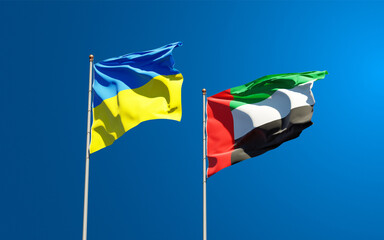 Beautiful national state flags of Ukraine and UAE United Arab Emirates together at the sky background. 3D artwork concept.