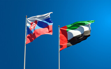 Beautiful national state flags of Slovakia and UAE United Arab Emirates together at the sky background. 3D artwork concept.