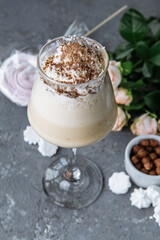cold fresh ice coffee with chocolate, garnished with biscuit and sweets