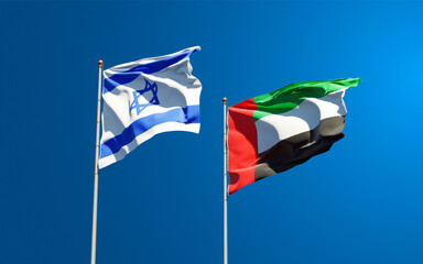 Beautiful national state flags of Israel and UAE United Arab Emirates together at the sky background. 3D artwork concept.