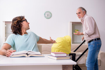 Retired grandfather looking after newborn at home