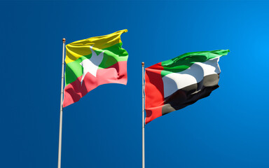 Beautiful national state flags of Myanmar and UAE United Arab Emirates together at the sky background. 3D artwork concept.