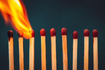 Burning matches isolated in dark background