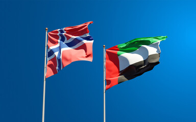 Beautiful national state flags of Norway and UAE United Arab Emirates together at the sky background. 3D artwork concept.