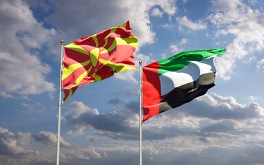 Beautiful national state flags of North Macedonia and UAE United Arab Emirates together at the sky background. 3D artwork concept.