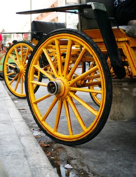 old wheels. yellow horse-drawn carriage