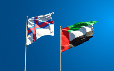 Beautiful national state flags of Faroe Islands and UAE United Arab Emirates together at the sky background. 3D artwork concept.