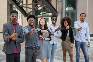 team of young people with hand gesture