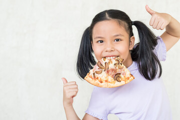 mmm, so delicious!, i recommend eat this delicious pizza! surprised little asia girl keeps slice of pizza in mouth, points with thumb, wants to eat, positive woman with junk food, people and eating.