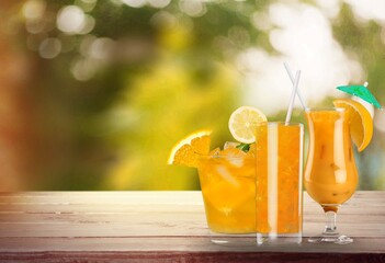 Orange juice in glass and slices of orange fruit