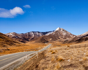 Road approaching Lindis Pass, Otago, New Zealand.