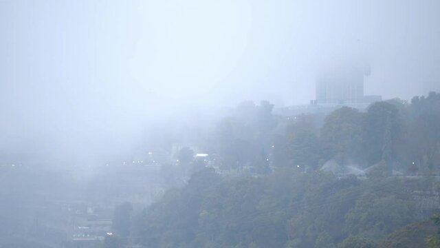 Eerie Fog Wrap The Lush Landscape Surrounding The Skylon Tower Near The Niagara Falls In Ontario, Canada - Steady Shot, Wide