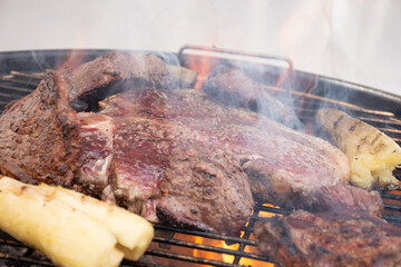 barbecue meats (t-bone and picanha) on the grill