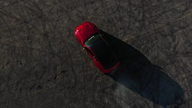 Done shot of muscle and sports cars doing doughnuts and burnouts with a car club in the Angeles National Forest in Southern California
