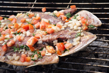 Grilled grilled fish with vinaigrette on top