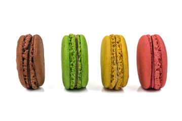 different delicious macaroons on white