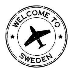 Grunge black welcome to Sweden word with airplane icon round rubber seal stamp on white background