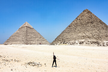 Egypt, Giza Girl tourist in the desert of ancient Cairo. Excursion. Pyramids.