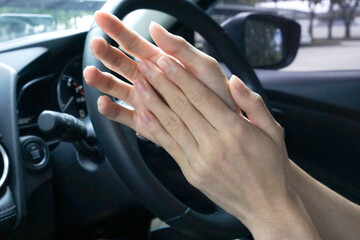 wash hand by alcohol gel sanitizer before driving car