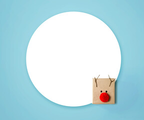 Handmade reindeer gift box with round paper - flat lay