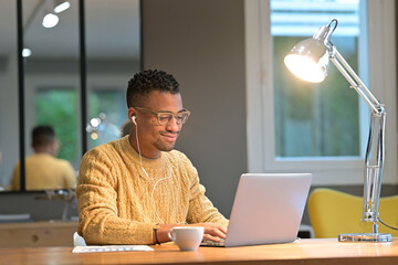 Portrait of african american trendy guy in a distant online call