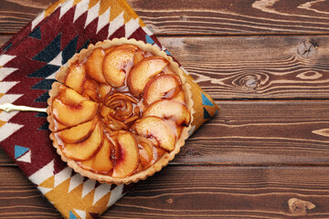 Top view of apple tart pie on tablecloth