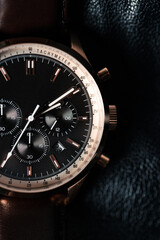 Fototapeta premium wrist watch man wrist watch on Leather Background
