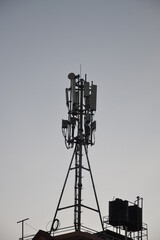 A telephone tower on the rooptop of a house in Kathmandu, Nepal.